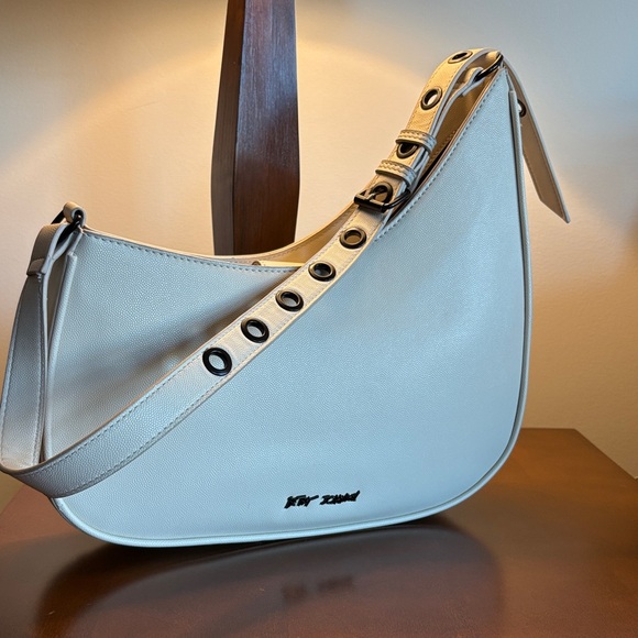 Betsey Johnson Handbags - Betsey Johnson Cream Shoulder Bag with Eyelet Strap beautiful